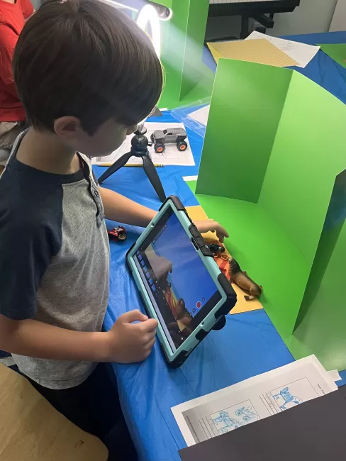 Child making stop motion video