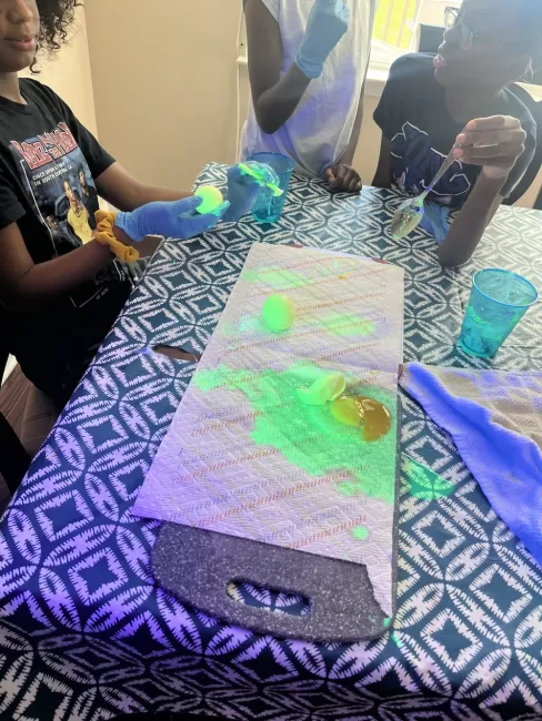 Kids experimenting with glow in the dark slime