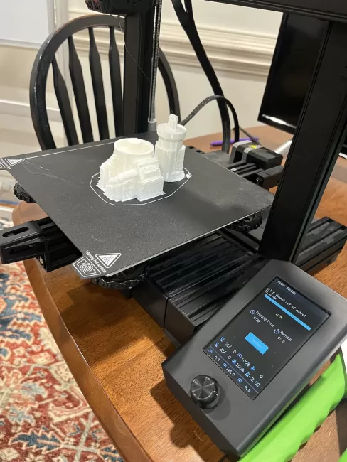 3D printer printing a building