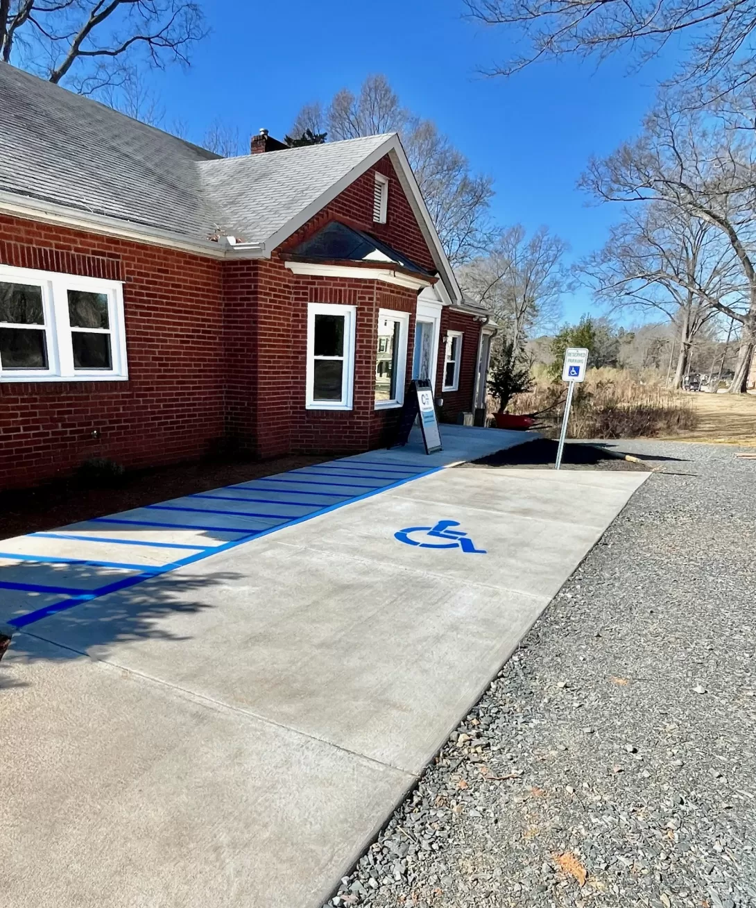 Photo of Creation Acre building showing handicap parking and driveway